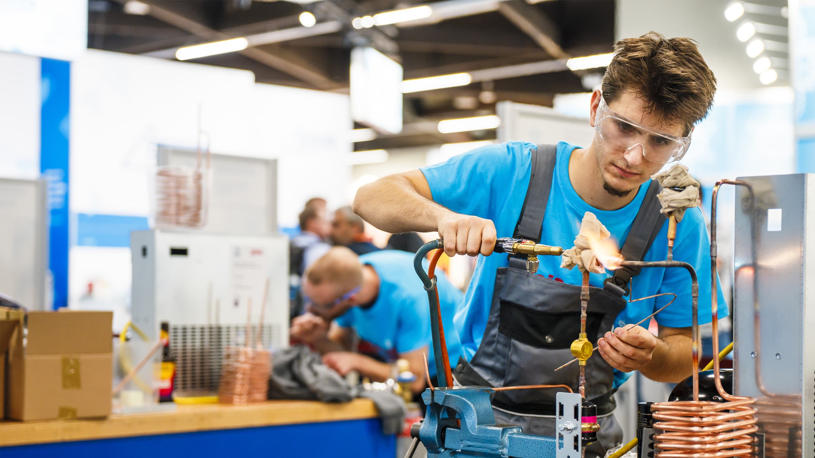 Young man soldering at the German German Craft Skills in Refrigeration Plant Assemblers at Chillven